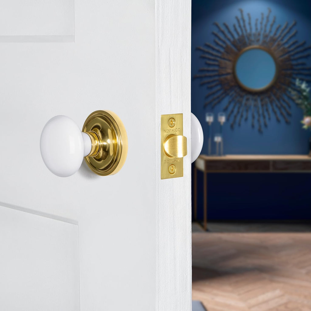 Classic Rosette Privacy White Porcelain Door Knob in Unlacquered Brass