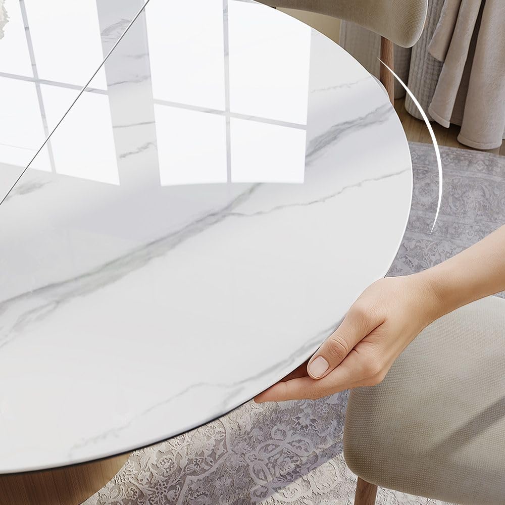 Modern Extendable Dining Table for 4-6, 47" to 63" Round to Oval Sintered Stone Kitchen Table with Carbon Steel Base
