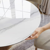 Modern Extendable Dining Table for 4-6, 47" to 63" Round to Oval Sintered Stone Kitchen Table with Carbon Steel Base