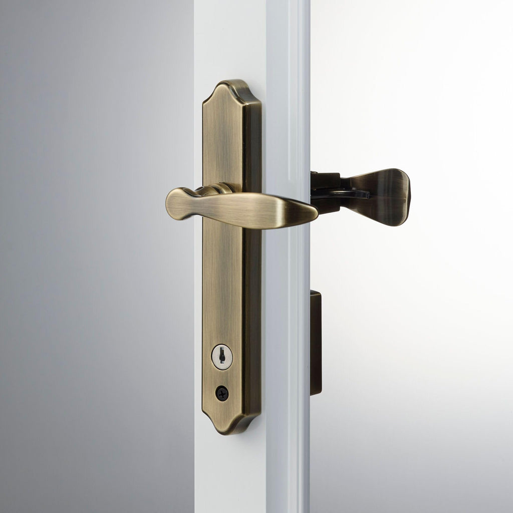 1216 Surface Mount Storm Door Handle with Lock and Key for 1 - 1 1⁄2 inches Thick Doors (Antique Brass, 4-Posts)