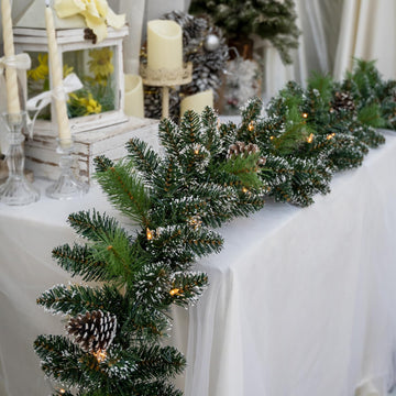 9FT Pre-Lit Artificial Christmas Garland with 50 Lights, White Garland with Pine Cones and Red Berries, Plug-in Snowy