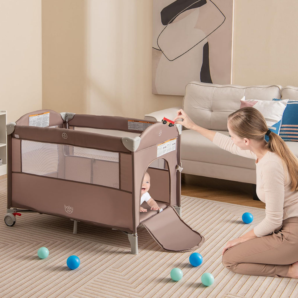JOY 5-in-1 Play Yard, Portable Baby Bedside Sleeper with Bassinet, U-Shaped Diaper Changer, Safety Strap, Side